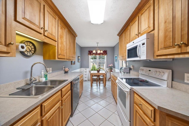 35 Hickory Nut Ln, Staunton, VA 24401 - kitchen with white appliances, a sink, light tile patterned floors, a chandelier, and brown cabinets