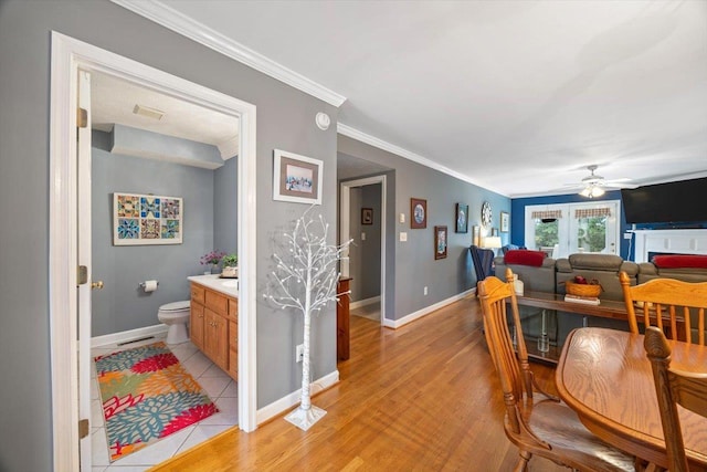 35 Hickory Nut Ln, Staunton, VA 24401 - dining area featuring baseboards, crown molding, ceiling fan, and light wood-style flooring