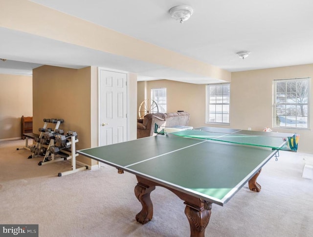 game room with baseboards and carpet flooring