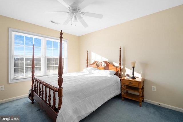 carpeted bedroom with a ceiling fan, visible vents, and baseboards