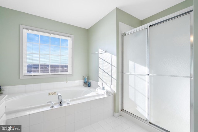 full bathroom featuring a shower stall, a bath, and tile patterned floors