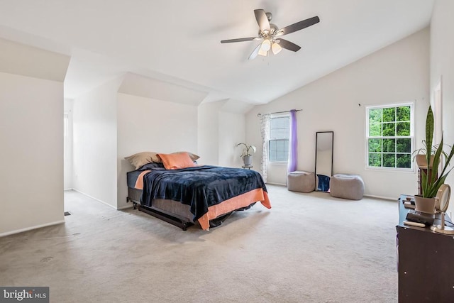 - bedroom featuring lofted ceiling, carpet floors, and a ceiling fan