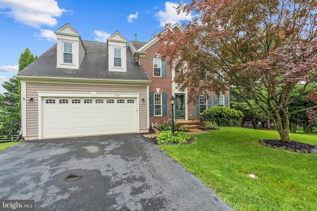  - view of front facade with asphalt driveway, a front yard, a garage, and roof with shingles