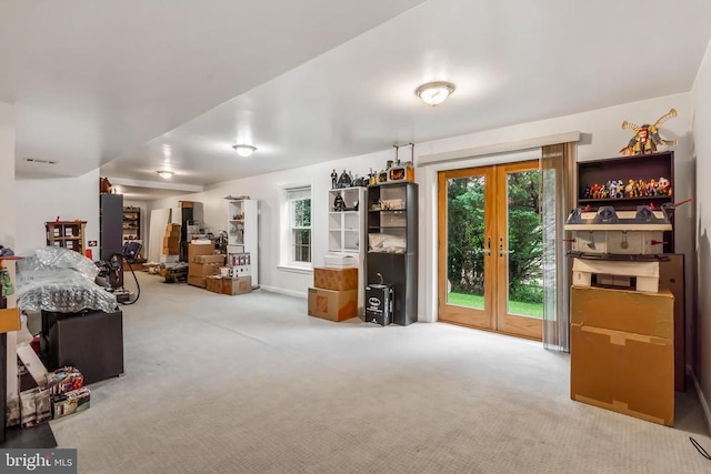  - carpeted bedroom featuring multiple windows, access to outside, and french doors