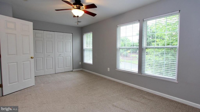 4605 Club Cart Cir, Fredericksburg, VA 22408 - unfurnished bedroom featuring light carpet, a closet, and a ceiling fan
