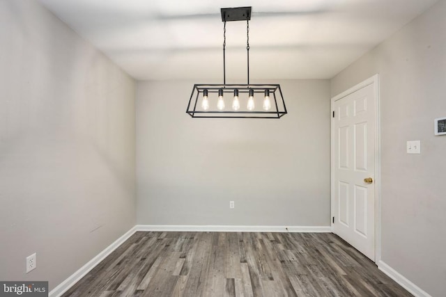 5122 Redbud Rd, Fredericksburg, VA 22407 - unfurnished dining area with wood finished floors and a chandelier