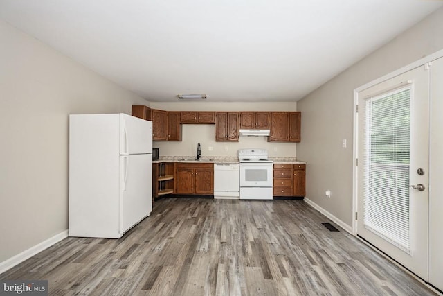5122 Redbud Rd, Fredericksburg, VA 22407 - kitchen featuring white appliances, light countertops, wood finished floors, and under cabinet range hood