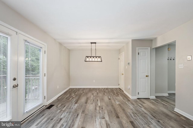 5122 Redbud Rd, Fredericksburg, VA 22407 - unfurnished dining area featuring wood finished floors and a chandelier