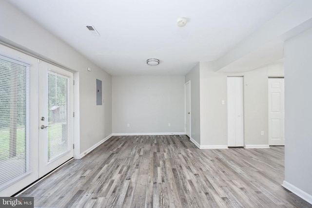5122 Redbud Rd, Fredericksburg, VA 22407 - spare room featuring wood finished floors, french doors, electric panel, and a smoke detector
