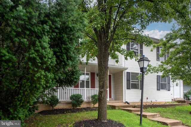 5122 Redbud Rd, Fredericksburg, VA 22407 - obstructed view of property featuring covered porch and a front lawn