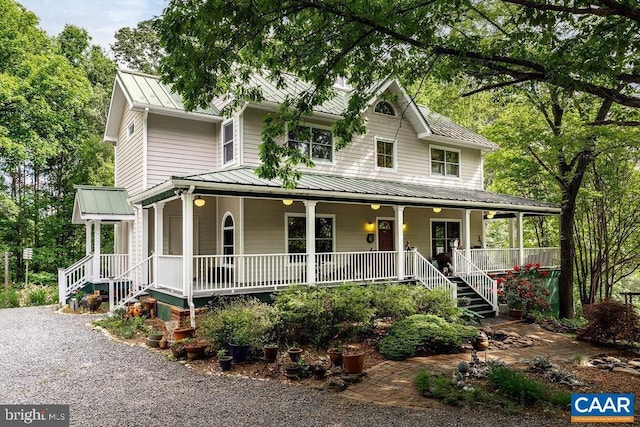 5864 Wyant Ln, Charlottesville, VA 22903 - farmhouse with covered porch, a standing seam roof, and metal roof