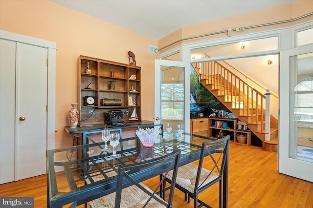 5864 Wyant Ln, Charlottesville, VA 22903 - dining space with stairs, plenty of natural light, and wood finished floors