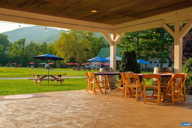 462 Winery Ln, Nellysford, VA 22958 - view of patio featuring a mountain view, fence, and outdoor dining space
