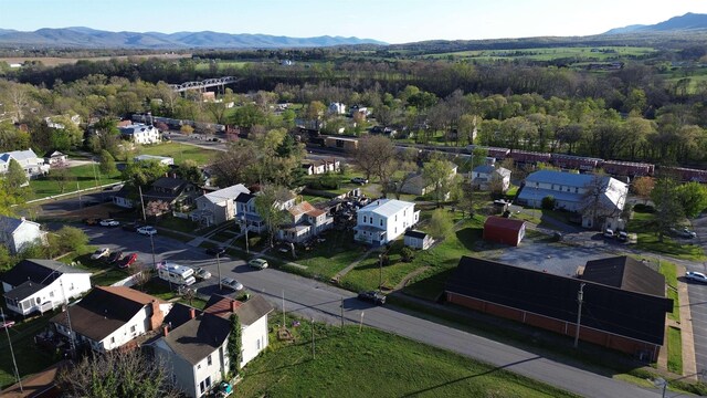 307 2nd St, Shenandoah, VA 22849 - aerial perspective of suburban area with a mountainous background and a heavily wooded area