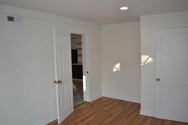 307 2nd St, Shenandoah, VA 22849 - empty room with dark wood-style flooring, baseboards, and recessed lighting