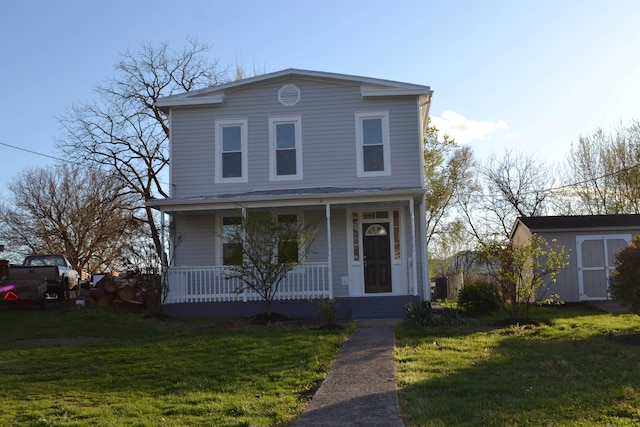 307 2nd St, Shenandoah, VA 22849 - traditional home with covered porch, a front yard, an outbuilding, and a shed
