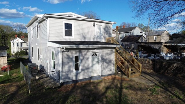 307 2nd St, Shenandoah, VA 22849 - rear view of house featuring a fenced backyard, stairs, and a residential view