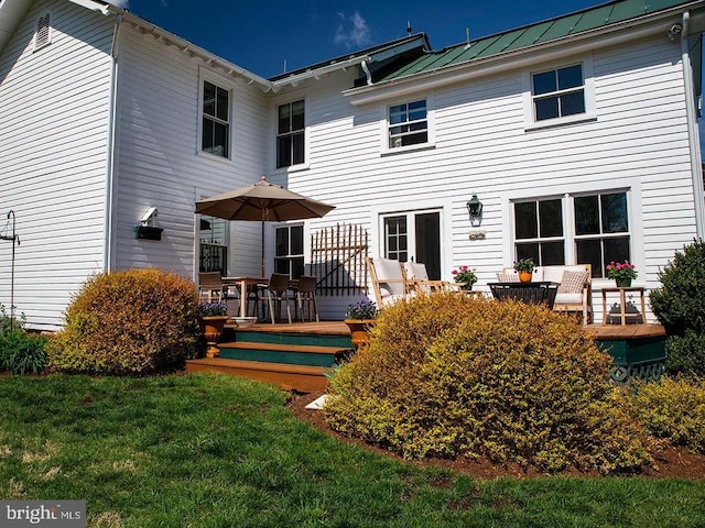 435 Larkins Mill Ln, Brightwood, VA 22715 - back of house featuring metal roof, a deck, a standing seam roof, and a lawn