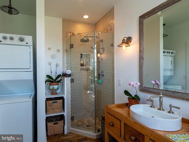 435 Larkins Mill Ln, Brightwood, VA 22715 - bathroom featuring wood finished floors, vanity, recessed lighting, stacked washer and clothes dryer, and a shower stall