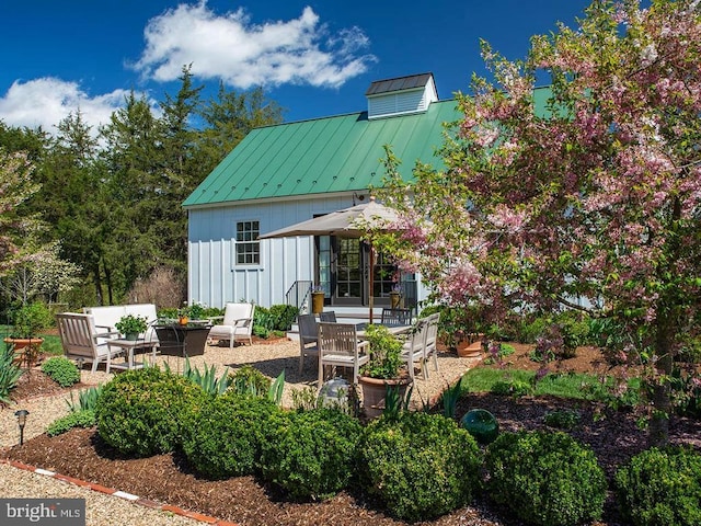 435 Larkins Mill Ln, Brightwood, VA 22715 - back of house featuring board and batten siding, a patio area, metal roof, and a standing seam roof