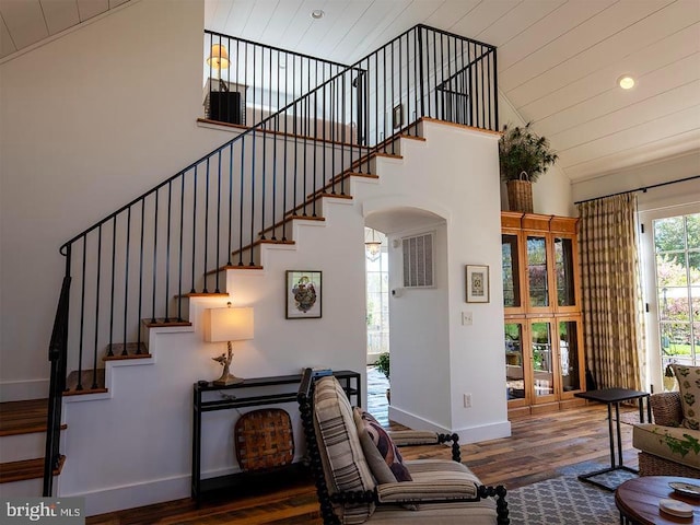 435 Larkins Mill Ln, Brightwood, VA 22715 - living room with stairs, baseboards, high vaulted ceiling, and wood finished floors