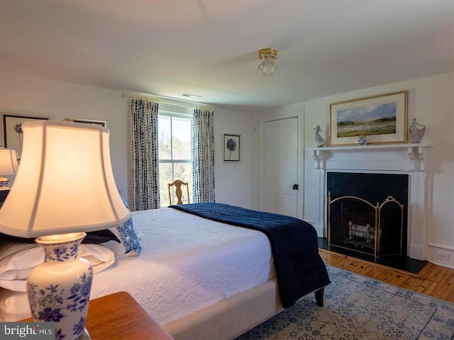 435 Larkins Mill Ln, Brightwood, VA 22715 - bedroom with a fireplace and wood finished floors