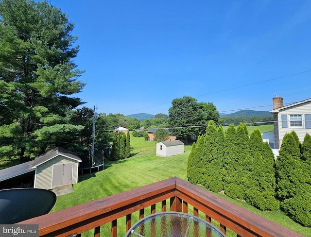 336 Blankenbaker Rd, Madison, VA 22727 - view of green lawn featuring a storage shed, a trampoline, and a mountain view