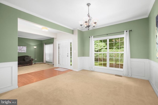 3113 Somerset Dr, Jeffersonton, VA 22724 - foyer entrance featuring carpet flooring, a chandelier, plenty of natural light, crown molding, and a wainscoted wall