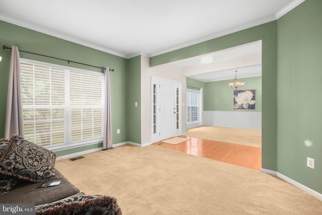 3113 Somerset Dr, Jeffersonton, VA 22724 - carpeted living area with crown molding and a chandelier