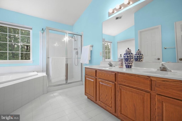 3113 Somerset Dr, Jeffersonton, VA 22724 - full bath featuring tile patterned flooring, double vanity, a shower stall, lofted ceiling, and healthy amount of natural light