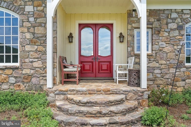  - doorway to property featuring stone siding