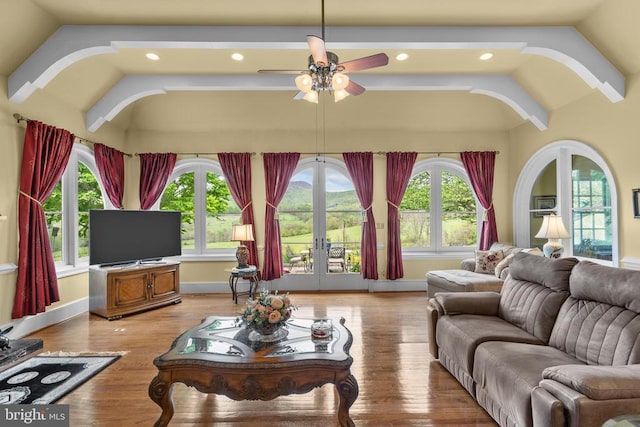  - living room featuring lofted ceiling, french doors, ceiling fan, recessed lighting, and light wood-style floors