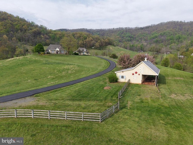  - view of rural area with a heavily wooded area