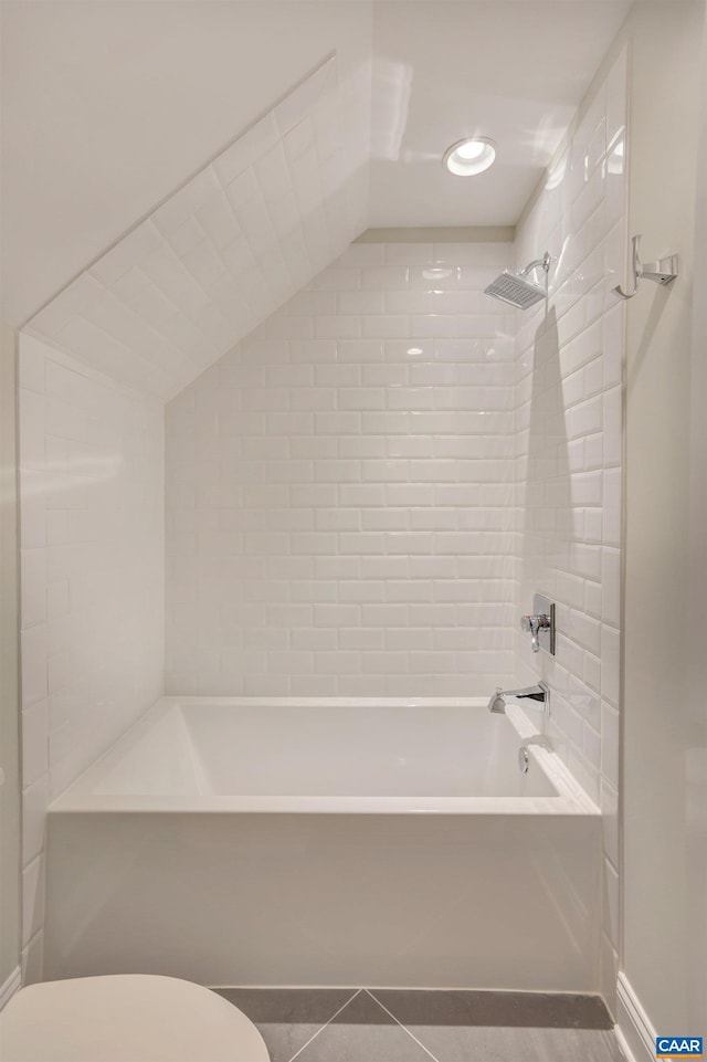 bathroom with tile patterned floors, toilet, and bathing tub / shower combination