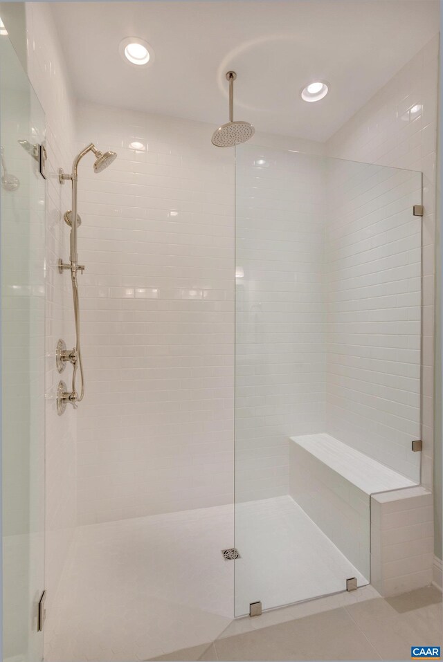 bathroom with tile patterned floors, a shower stall, and recessed lighting