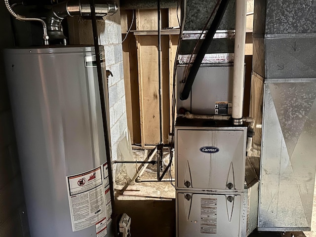 utility room featuring water heater and heating unit