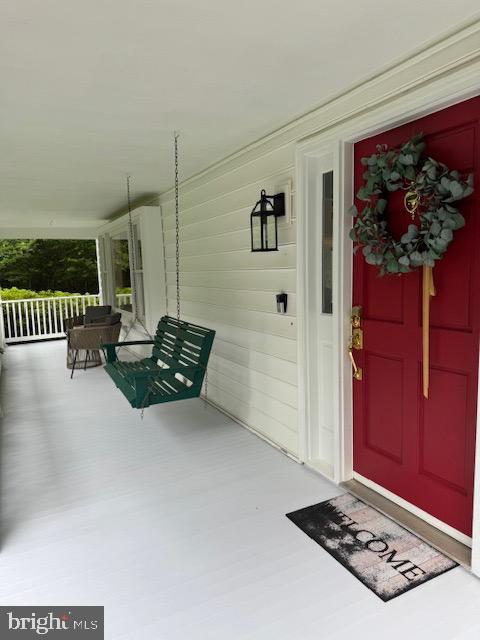  - property entrance featuring a porch