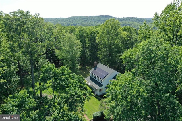  - view from above of property featuring a heavily wooded area