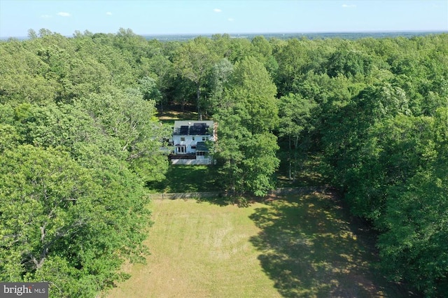  - view of property location featuring a heavily wooded area