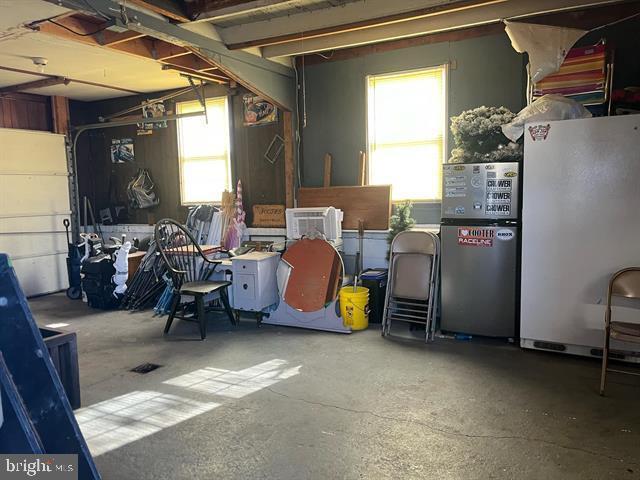 885 Main St W, Stanley, VA 22851 - below grade area featuring freestanding refrigerator and a garage