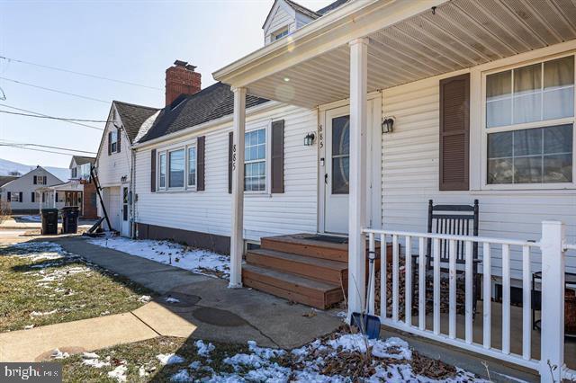 885 Main St W, Stanley, VA 22851 - snow covered property entrance with a porch