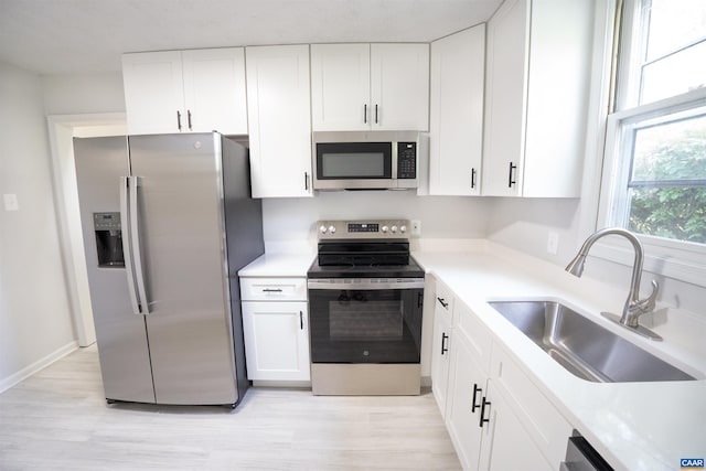 158 Scarborough Pl, Charlottesville, VA 22903 - kitchen featuring stainless steel appliances, white cabinetry, and light wood-type flooring