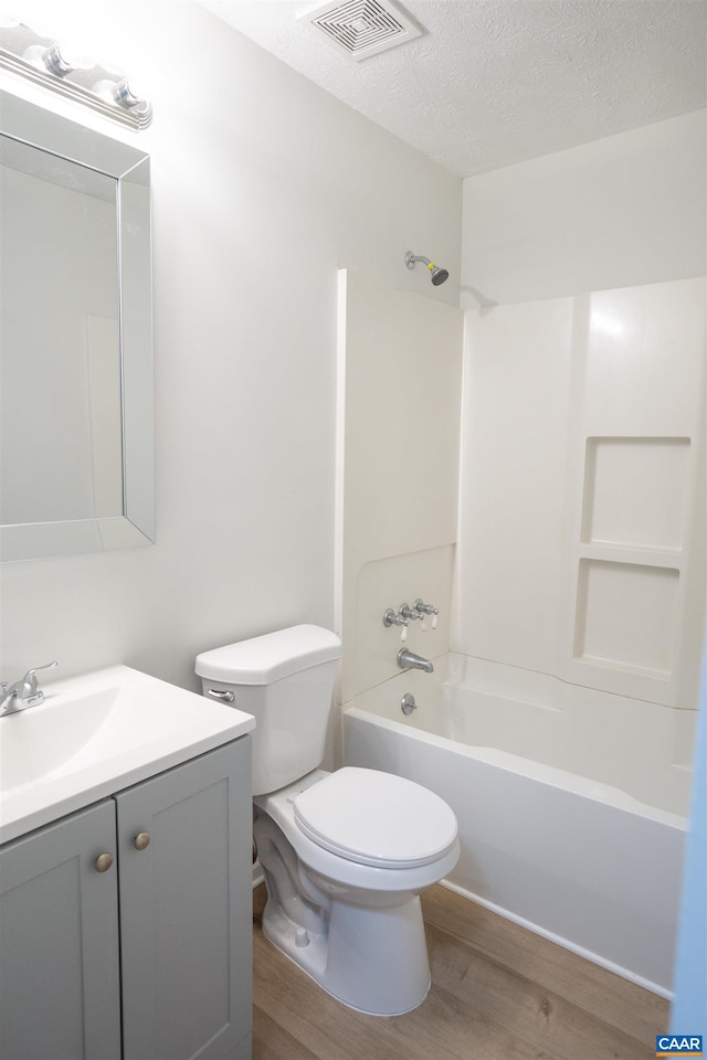 158 Scarborough Pl, Charlottesville, VA 22903 - full bath with wood finished floors, vanity, tub / shower combination, and a textured ceiling