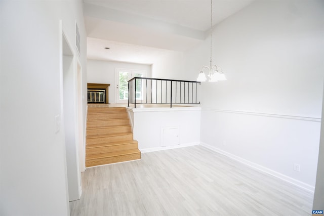 158 Scarborough Pl, Charlottesville, VA 22903 - spare room with light wood-style floors, a chandelier, and stairway