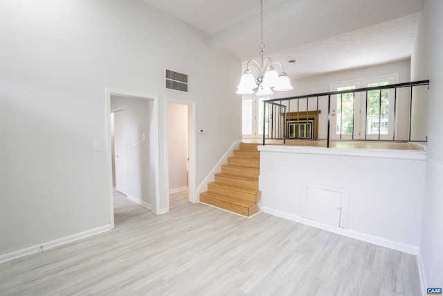 158 Scarborough Pl, Charlottesville, VA 22903 - unfurnished dining area featuring wood finished floors, a chandelier, stairs, and high vaulted ceiling