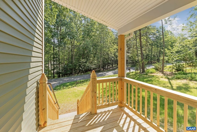 34 Turkeysag Trl, Palmyra, VA 22963 - wooden porch featuring a lawn and view of wooded area