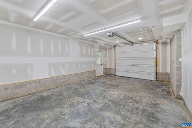 34 Turkeysag Trl, Palmyra, VA 22963 - garage with concrete block wall and a garage door opener