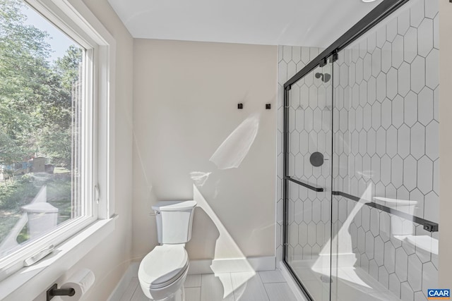 34 Turkeysag Trl, Palmyra, VA 22963 - full bath with healthy amount of natural light, tiled shower, and tile patterned floors