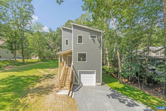 34 Turkeysag Trl, Palmyra, VA 22963 - view of front of house with driveway, stairs, a garage, and a front lawn