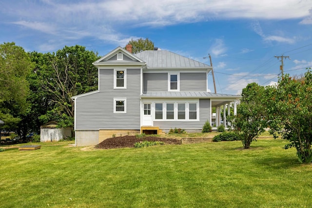 630 Battlefield Rd, Fort Defiance, VA 24437 - back of house with a standing seam roof, a chimney, a lawn, metal roof, and a storage unit